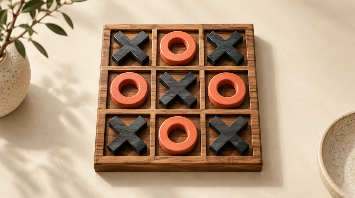 Editorial Tic Tac Toe board with balanced charcoal X and coral O pieces illustrating perfect-play draw defense.